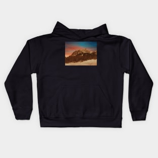 Sunset over the snowy mountains Kids Hoodie